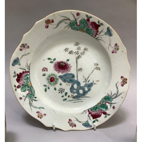 46 - An 18th century Chinese famille rose plate enamelled with racks issuing chrysanthemum and bamboo, 23... 