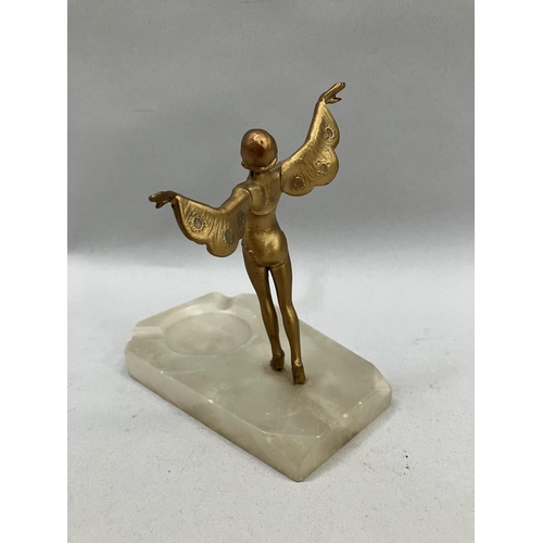 18 - A gilt metal mounted alabaster ashtray in the form of a dancer, 12.5cm long x 8cm wide x 13.5cm high