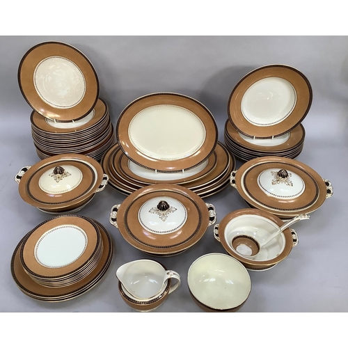 27 - A Bishop's dinner service of brown, cream and black with gilt leaf borders comprising seven plates, ... 