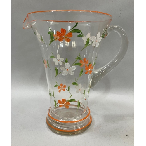 5 - A 1950s lemonade set, clear glass painted in orange, green and white flowers, comprising jug and six... 
