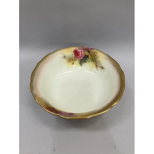 22 - A Royal Worcester rose painted bowl highlighted in gilt, printed mark with date cypher for 1916, 19.... 