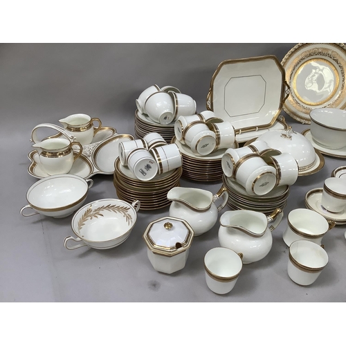 44 - A large quantity of gilt and black on white tea ware of various designs together with a triple hors ... 