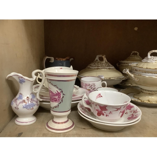 41 - A collection of 19th century Sunderland ware including a large jug decorated with fruits, sugar bowl... 