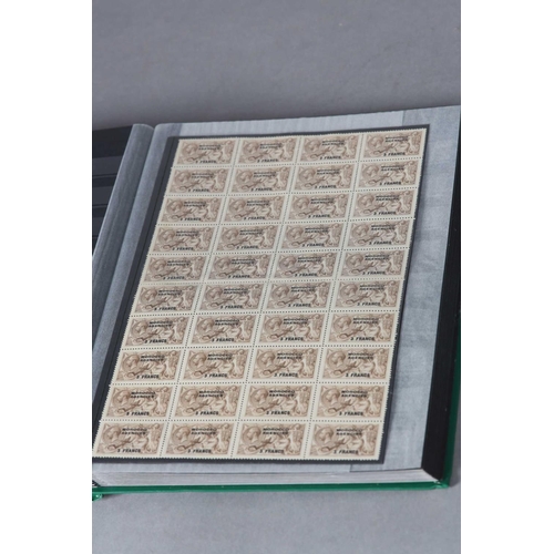 38 - TWO GREEN COVER GLASSINE SHEET STOCK BOOKS with a rare specialist and unique collection of GB Coloni... 