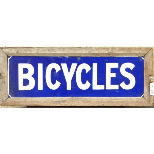 359 - BICYCLES an enamel sign housed in a wooden framed. 10 x 26 inches

Please note we are unable to offe... 