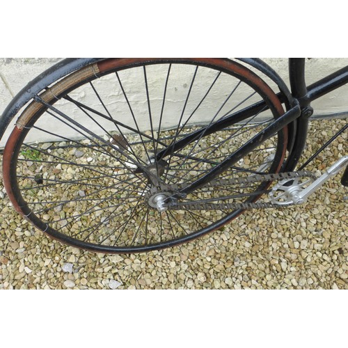 223 - A c1890 Cross Frame Bicycle, with a braced top tube, 30 inch front and 28 inch rear wheel, saddle 27... 