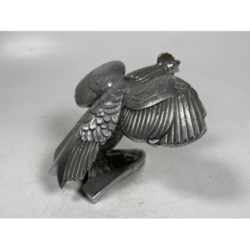 12 - A Singer Bantam vintage car mascot

This item is Category B on our Shipping Policy