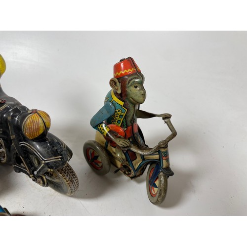 50 - Tinplate Motorcycles (5). One Monkey on a Tricycle, Policia, One Monkey with Sidecar and 2x Black Mo... 
