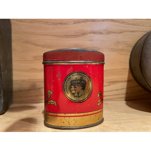 46 - Three Vintage Tins, One Cast, One Tin Moneyboy and One Biscuit Tin

Shipping Rate B