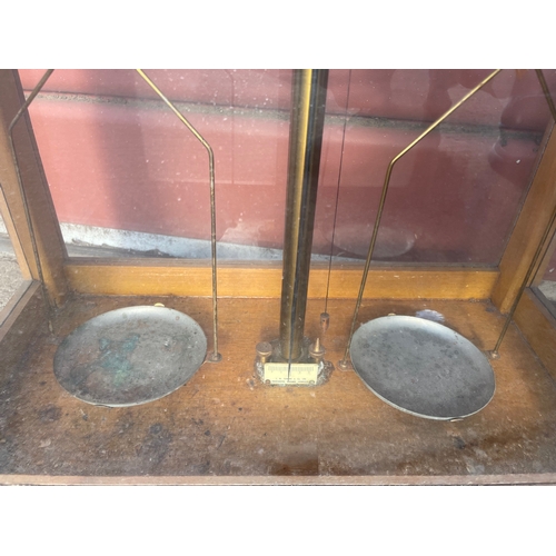 15 - 2no Laboratory Analytical Balances in Glazed Cases. One by L'Oertling & Co of London.

In House Ship... 