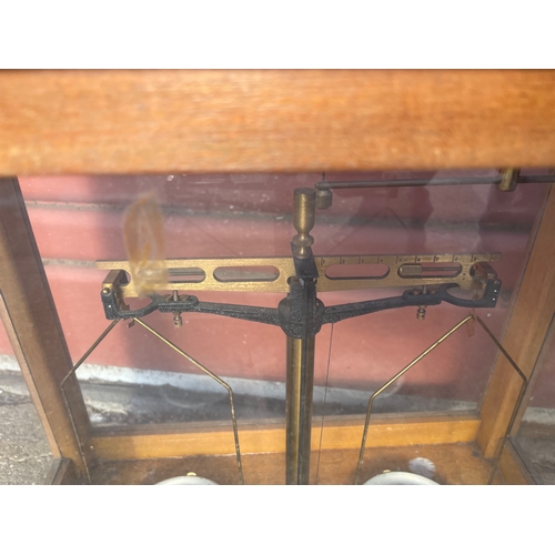 15 - 2no Laboratory Analytical Balances in Glazed Cases. One by L'Oertling & Co of London.

In House Ship... 