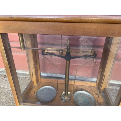 15 - 2no Laboratory Analytical Balances in Glazed Cases. One by L'Oertling & Co of London.

In House Ship... 