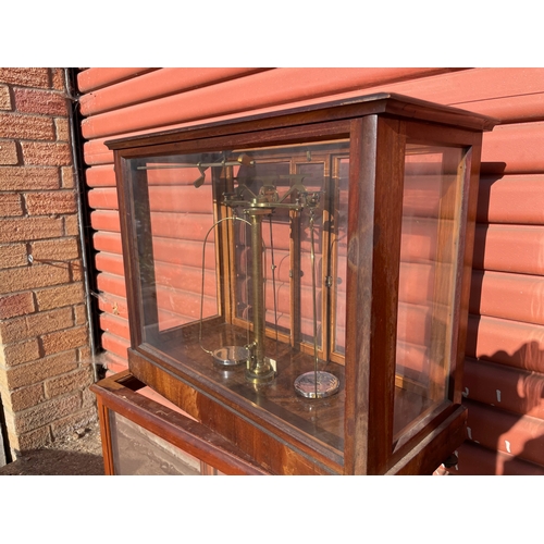 16 - A Laboratory Analytical Balance in Glazed Mahongany Cabinet t/w an Empty Cabinet

In House Shipping ... 