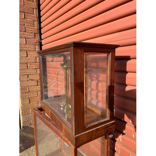 16 - A Laboratory Analytical Balance in Glazed Mahongany Cabinet t/w an Empty Cabinet

In House Shipping ... 
