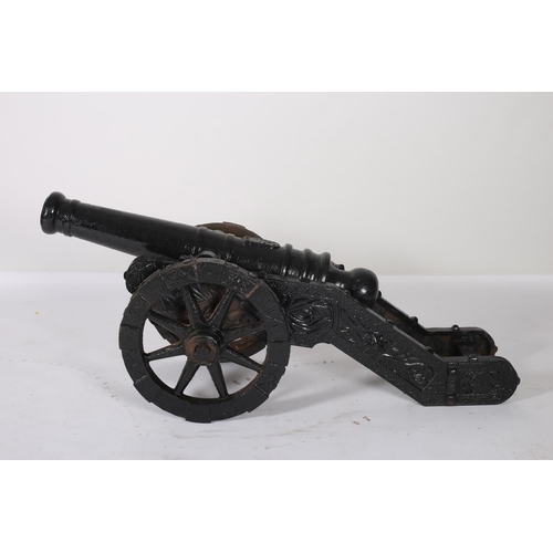 42 - A PAIR OF CAST IRON CANNONS of typical form 58cm (h) x 48cm (w) x146cm (d)