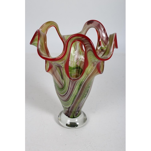 105 - A MULTICOLOURED GLASS VASE of irregular outline the pierced rim above a circular foot 40cm (h) x 27c... 