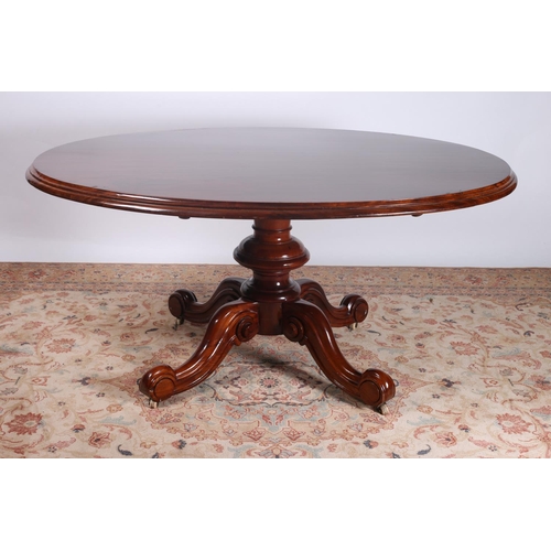 29 - A VICTORIAN MAHOGANY POD TABLE the oval moulded top above a baluster column with quadruped splayed l... 