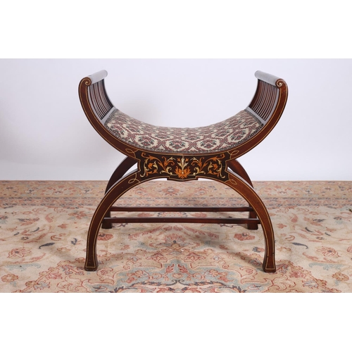 32 - AN EDWARDIAN MAHOGANY INLAID STOOL the curved seat with pierced splats on curved legs joined by cros... 