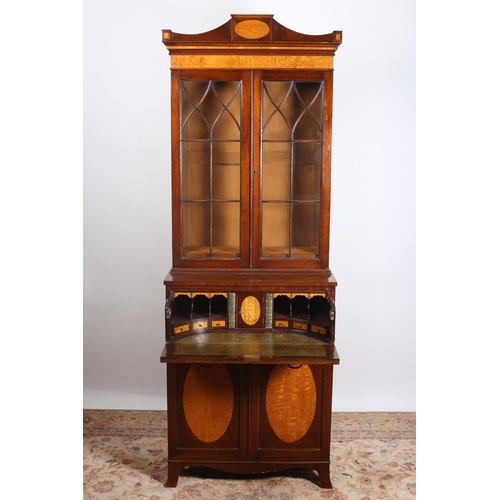 41 - A SHERATON DESIGN MAHOGANY AND SATINWOOD INLAID SECRETAIRE LIBRARY BOOKCASE the shaped cornice above... 