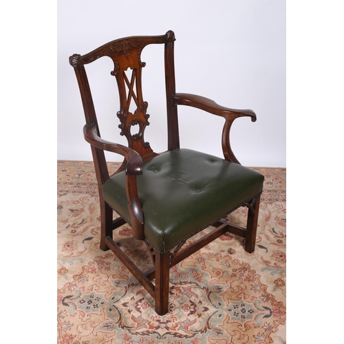 44 - A GOOD GEORGIAN MAHOGANY CHIPPENDALE ELBOW CHAIR the carved top rail and splat with scroll arms with... 
