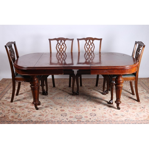 65 - A SEVEN PIECE MAHOGANY DINING ROOM SUITE comprising six Chippendale design mahogany dining chairs ea... 