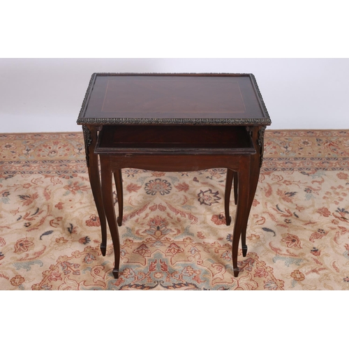 68 - A CONTINENTAL KINGWOOD AND GILT BRASS MOUNTED NEST OF TWO TABLES each of rectangular outline with br... 