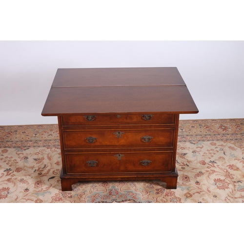 72 - A GEORGIAN DESIGN WALNUT CROSS BANDED BACHELOR'S CHEST the rectangular hinged top above four long gr... 