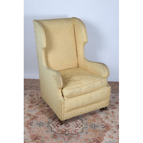 78 - A MAHOGANY AND UPHOLSTERED WING CHAIR with loose cushion and scroll arms with bun feet together with... 