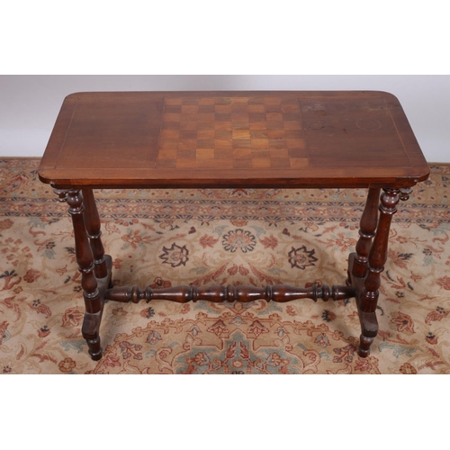 81 - AN EDWARDIAN MAHOGANY INLAID GAMES TABLE of rectangular outline with inlaid chess board on dual turn... 