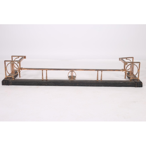 84 - AN ART DECO COPPER BRASS AND BLACK METAL FENDER the rectangular open work frame above a stepped plat... 