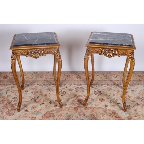 86 - A PAIR OF CONTINENTAL CARVED GILT WOOD AND MARBLE TABLES each of square outline with veined marble i... 