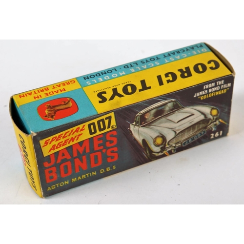 235 - James Bond. Corgi Toys, 007’s Aston Martin DB5. from the film “Goldfinger”, gold body with red inter... 