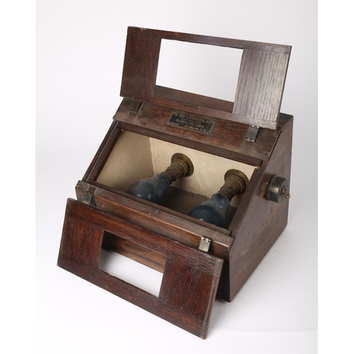 130 - 1930s-40s Irish Electro Medical Company X-Ray viewer. An oak slope-front cabinet the interior with t... 