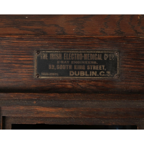 130 - 1930s-40s Irish Electro Medical Company X-Ray viewer. An oak slope-front cabinet the interior with t... 