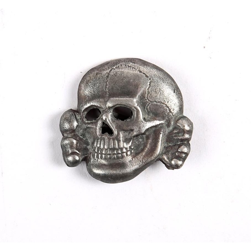 136 - 1934 to 1945 German death's head badge. The second version of the SS-Totenkopf the reverse marked 