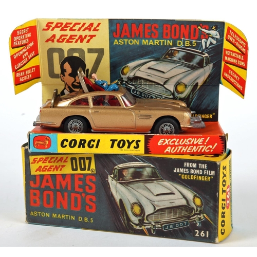 235 - James Bond. Corgi Toys, 007’s Aston Martin DB5. from the film “Goldfinger”, gold body with red inter... 