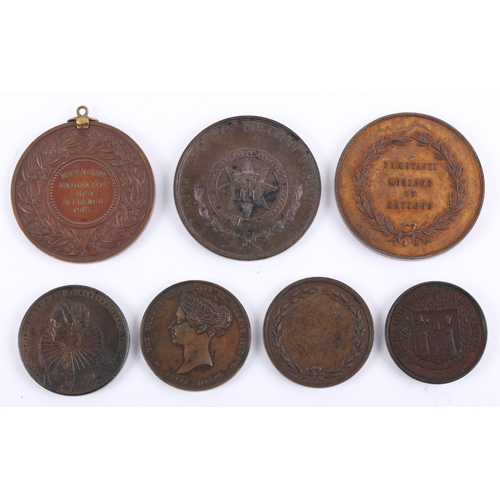 54 - A collection of Irish educational award medals. A St Patrick's College, Carlow copper medal; The Que... 