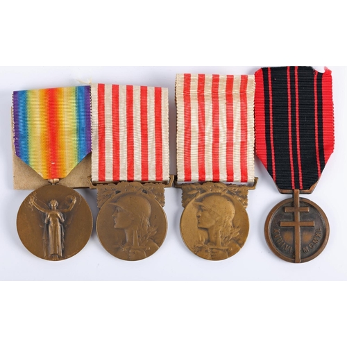 56 - A 1914–1918 Inter-Allied Victory medal, two 1914–1918 Commemorative war medals and a Resistance Meda... 
