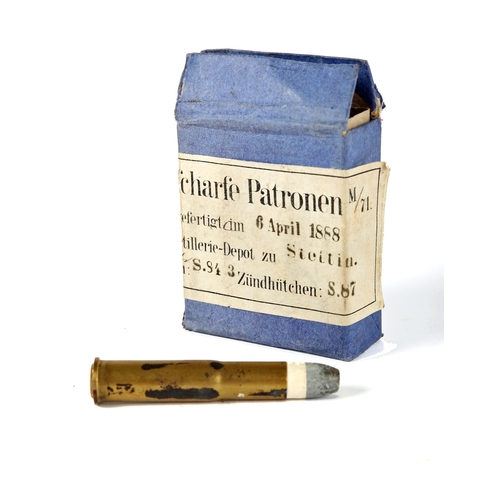 76 - Howth Mauser cartridge in carton. An inert M71 black-powder cartridge for a Mauser Model 1871 milita... 