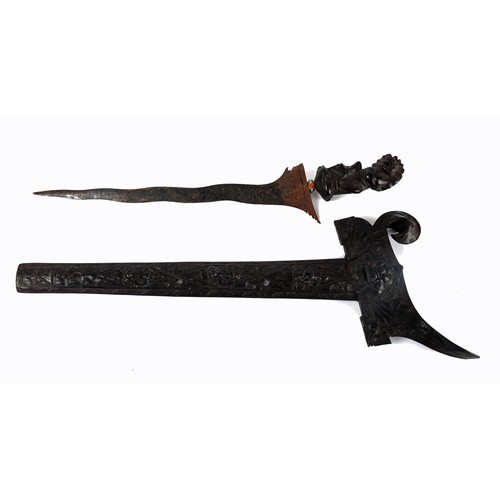 205A - An Indonesian kris, the wavy blade with attractive pamor pattern, the hilt and sheath of ornately ca... 