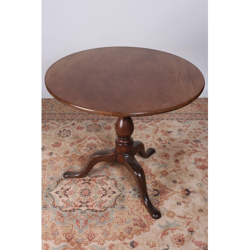 63 - A GEORGIAN MAHOGANY SNAP TOP TABLE the circular top above a baluster column on tripod support with p... 