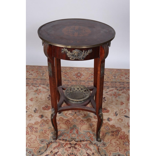 65 - A CONTINENTAL KINGWOOD MARQUETRY AND GILT BRASS MOUNTED TABLE the circular top with brass banding on... 