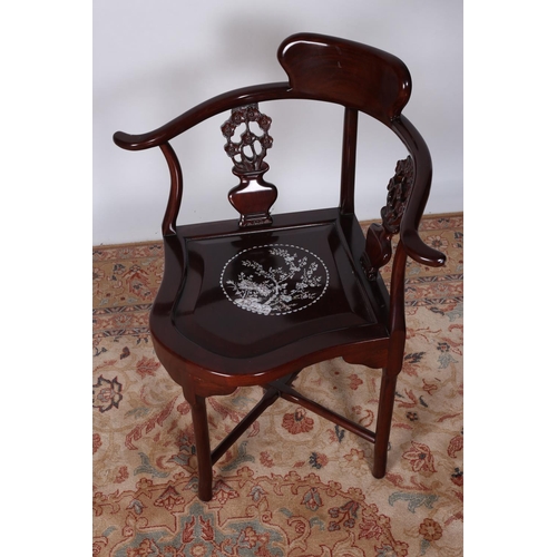 66 - AN ORIENTAL HARDWOOD AND MOTHER OF PEARL INLAID CORNER CHAIR the shaped back with pierced carved spl... 