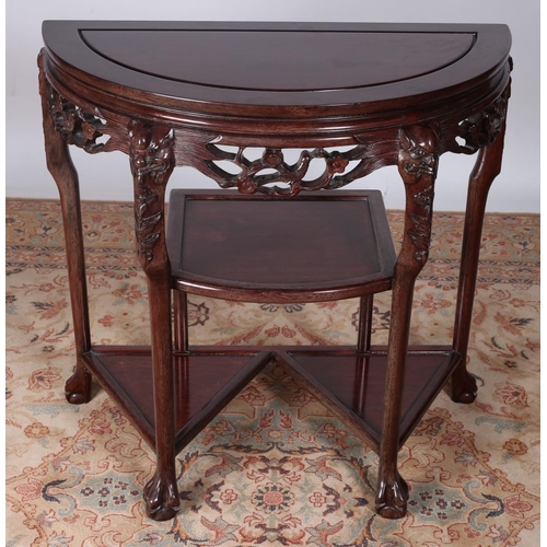 67 - AN ORIENTAL HARDWOOD SIDE TABLE of demilune outline with pierced carved frieze on cabriole legs with... 