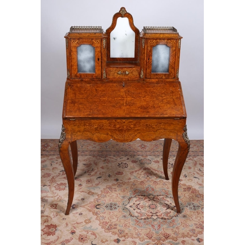 69 - A 19TH CENTURY CONTINENTAL WALNUT AND MARQUETRY BUREAU the superstructure with glazed cupboards and ... 