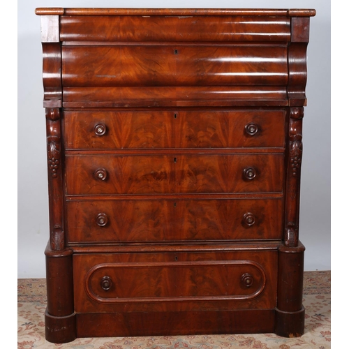 87 - A VICTORIAN MAHOGANY SCOTCH CHEST of inverted breakfront outline the shaped top above six long drawe... 