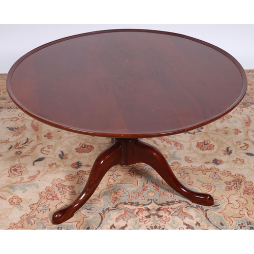88 - A MAHOGANY COFFEE TABLE the circular dish top above a baluster column on tripod support 46cm (h) x 7... 