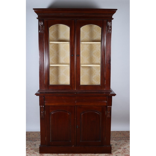 24 - A VICTORIAN DESIGN MAHOGANY LIBRARY BOOKCASE the moulded cornice above a pair of glazed doors the ba... 