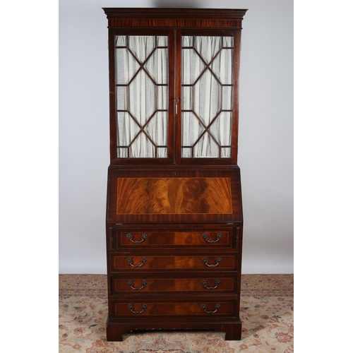 26 - A GEORGIAN DESIGN MAHOGANY AND SATINWOOD INLAID BUREAU BOOKCASE the dentil moulded cornice above a p... 