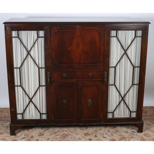 27 - A MAHOGANY SIDE CABINET with hinged compartment frieze drawer and cupboards flanked by astragal glaz... 